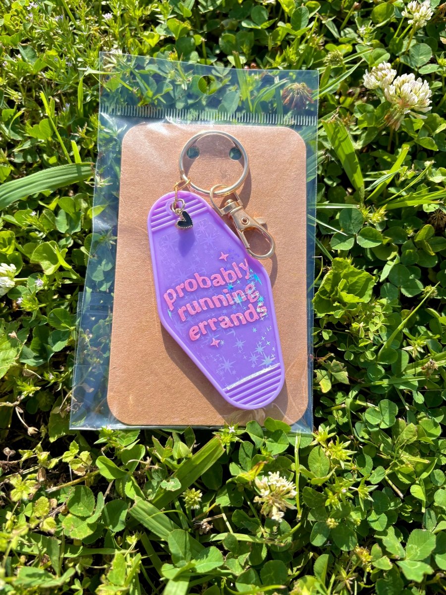 handmade motel style purple holographic acrylic keychain iridescent lettering probably running errands sparkle details gold clasp black heart charm