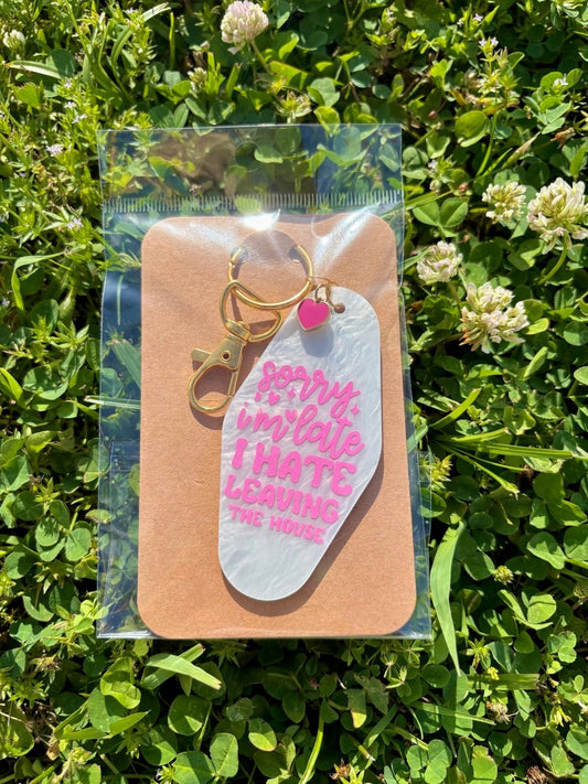 handmade motel style pearlescent white acrylic keychain hot pink lettering sorry i'm late i hate leaving the house gold clasp pink heart charm