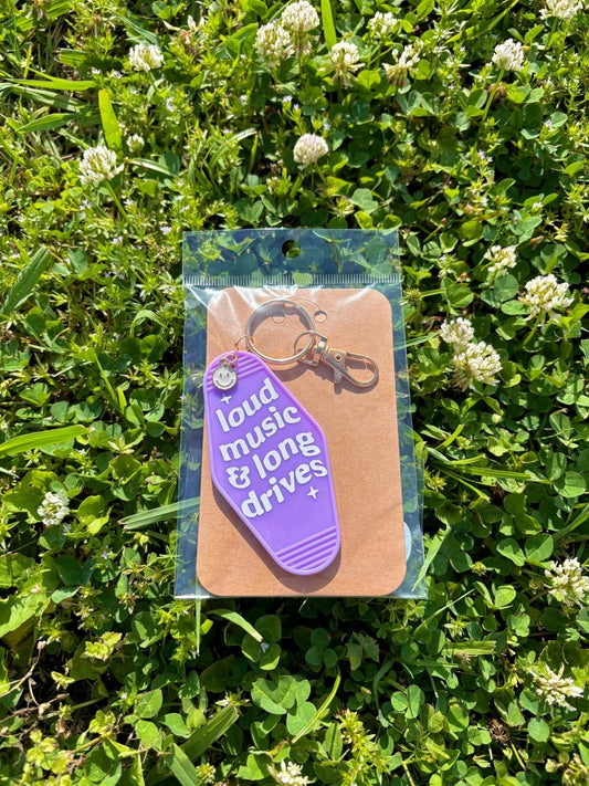 handmade motel style purple acrylic keychain white lettering loud music and long drives gold clasp smiley charm