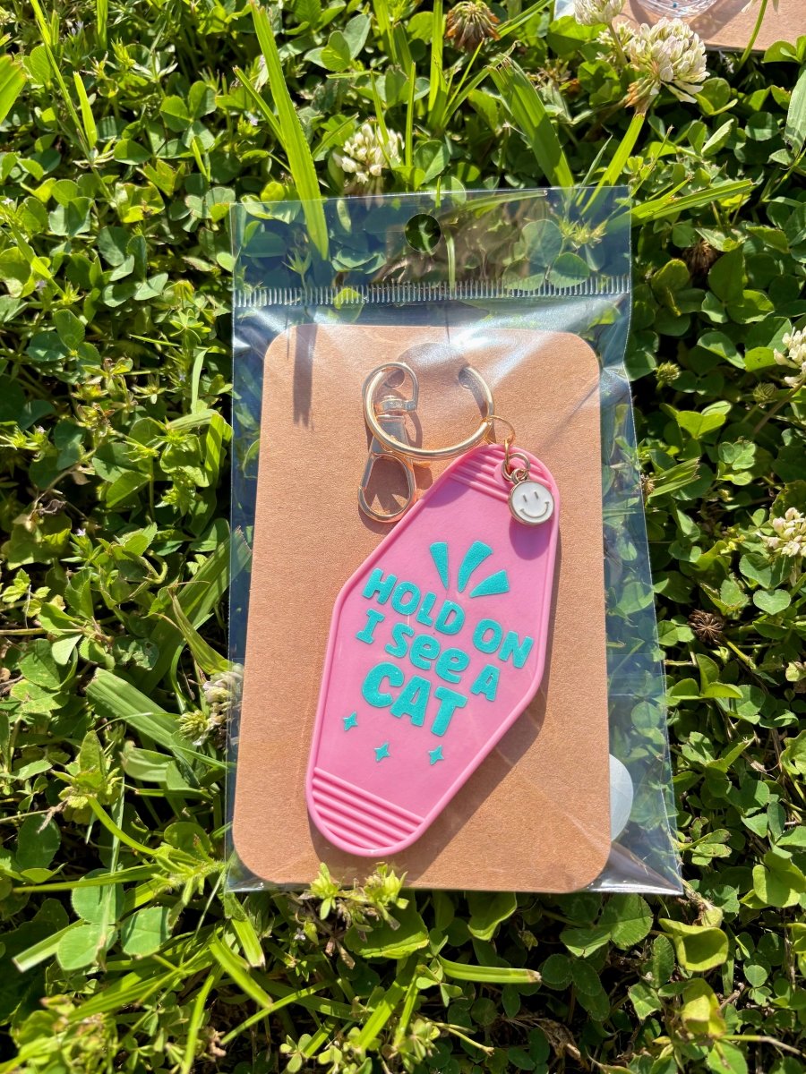 handmade motel style pink acrylic keychain teal lettering hold on i see a cat gold clasp smiley charm
